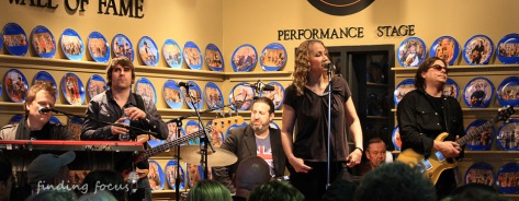 Joan Osborne and band performing at WDVX