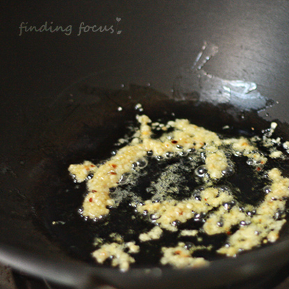 browning garlic, cooking with garlic, garlic and olive oil in a skillet